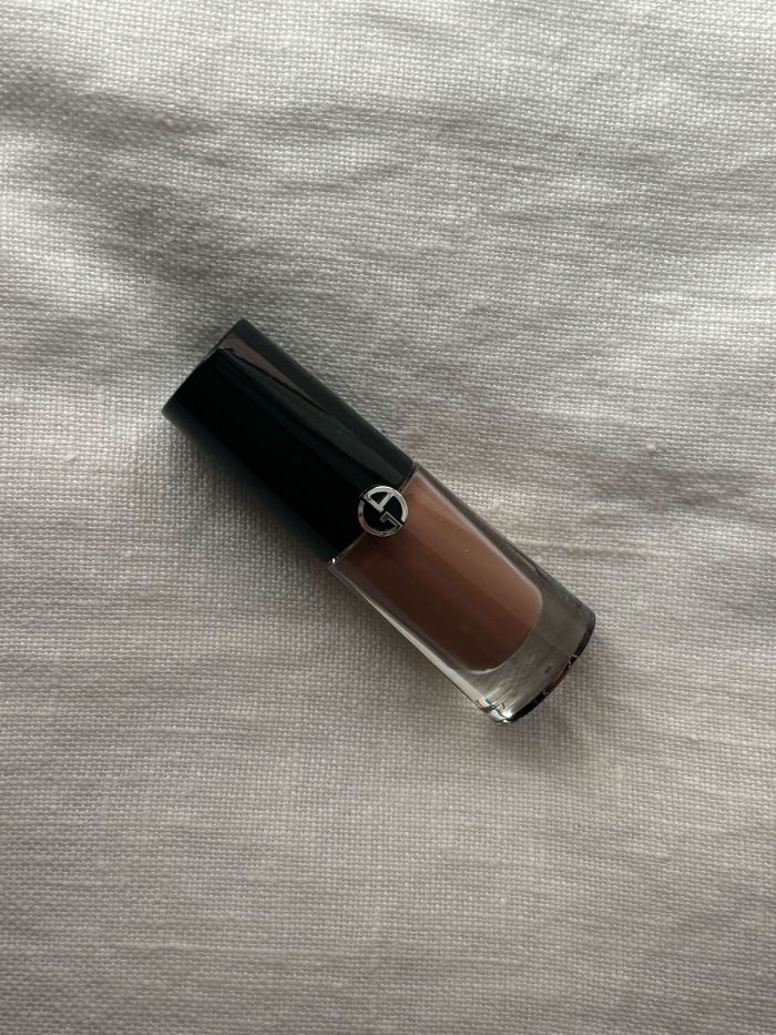 An Armani brown eyeshadow on a white background