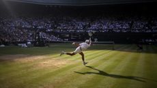 Serbia's Novak Djokovic in action during his quarter final match against Canada's Felix Auger-Aliassime at the Wimbledon Championships in London, United Kingdom