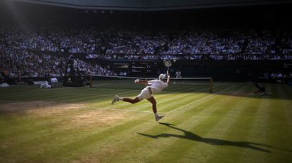 Serbia's Novak Djokovic in action during his quarter final match against Canada's Felix Auger-Aliassime at the Wimbledon Championships in London, United Kingdom
