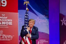 Trump hugs the flag