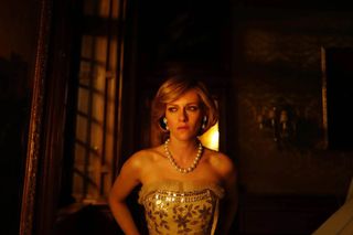 kristen stewart as princess diana in a gown crying in a dark room in the movie spencer