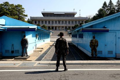 South Korean soldiers stand guard at the border between North and South Korea.