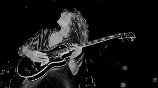 English Rock musician John Sykes, of the group Whitesnake, performs onstage at the UIC Pavilion, Chicago, Illinois, November 10, 1984