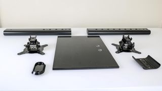 All the pieces that make up the Hemudu double monitor stand