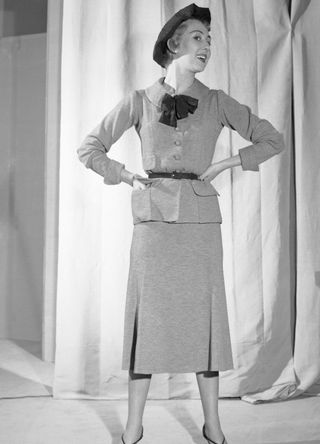 A woman modelling a jersey outfit designed by Chanel