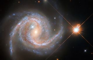 A Hubble Space Telescope image of spiral galaxy NGC 5495 in the constellation Hydra.
