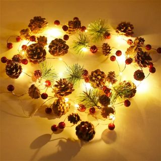 delicate garland with fir, pinecones, and berries