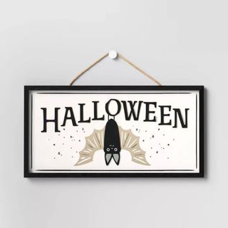 Wood Halloween Bat Sign against gray background.