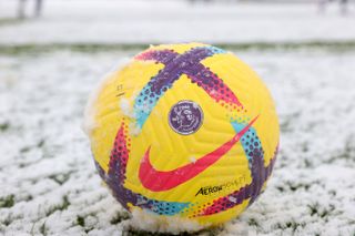 A Premier League yellow ball sits on the snow during the Leicester City training session at Leicester City Training Ground, Seagrave on March 09, 2023 in Leicester, United Kingdom.