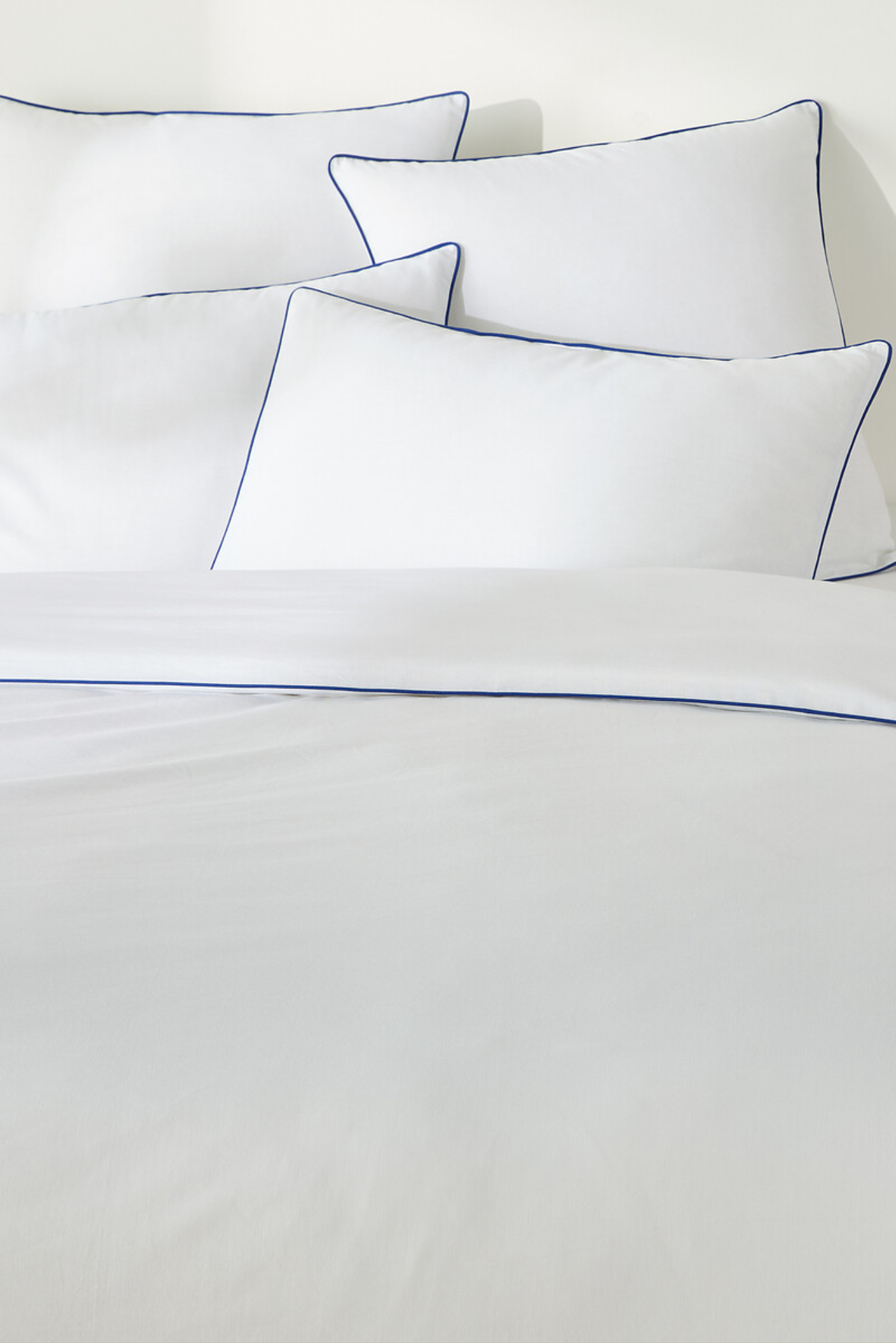 White bedding with blue piping