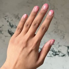 Iram Shelton wearing shimmery pink nail polish