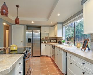 A bright kitchen with a tray ceiling
