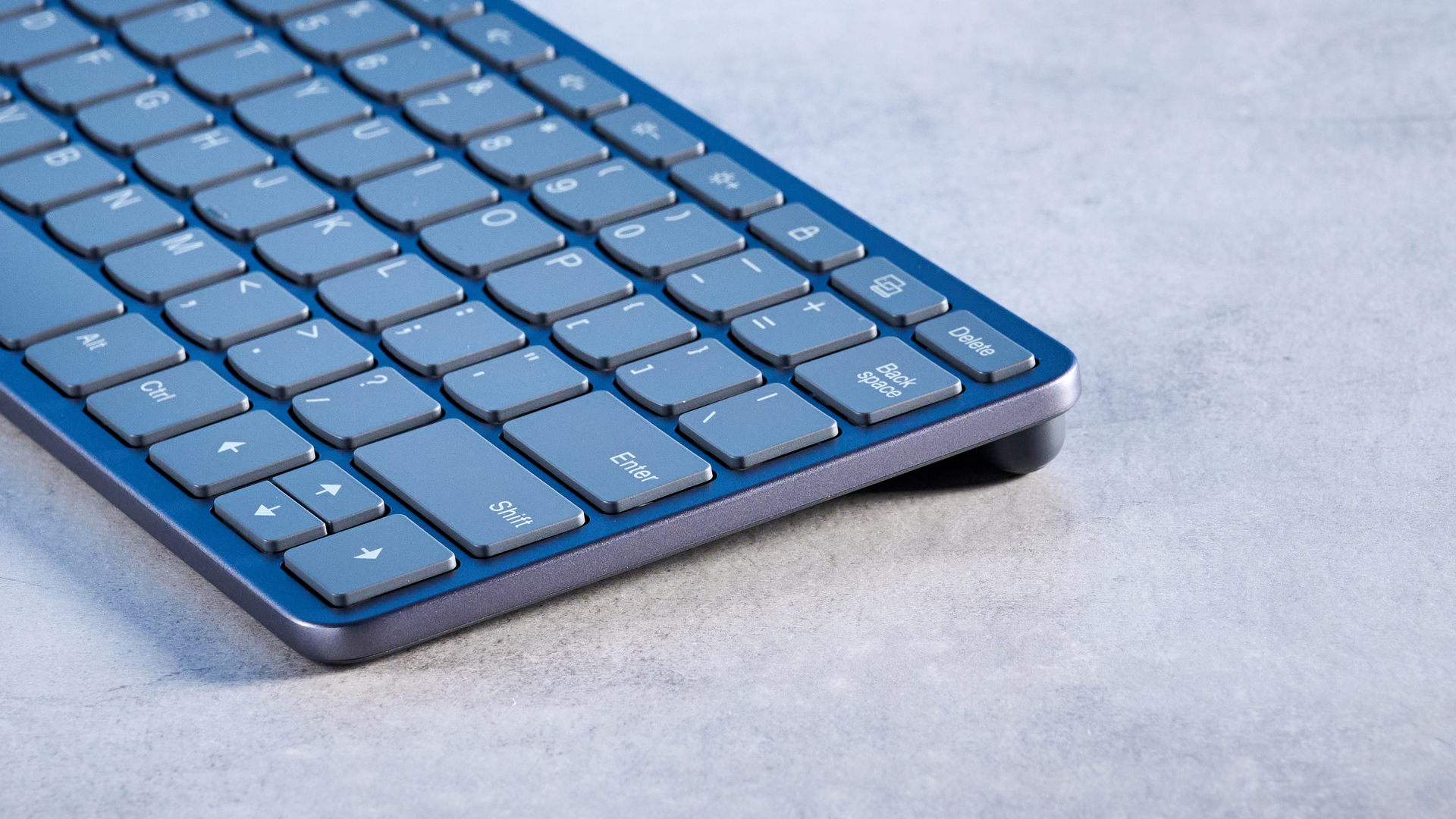 Lenovo Multi Device Keyboard photographed in front of a blue background.