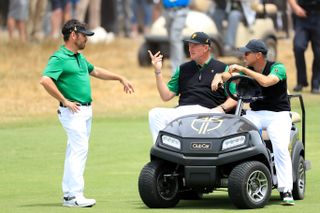 Louis Oosthuizen speaks to Ernie Els and Trevor Immelman