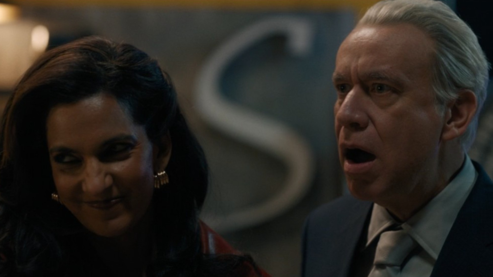Poorna Jagannathan smirking and Fred Armisen looking shocked in Deli Boys.