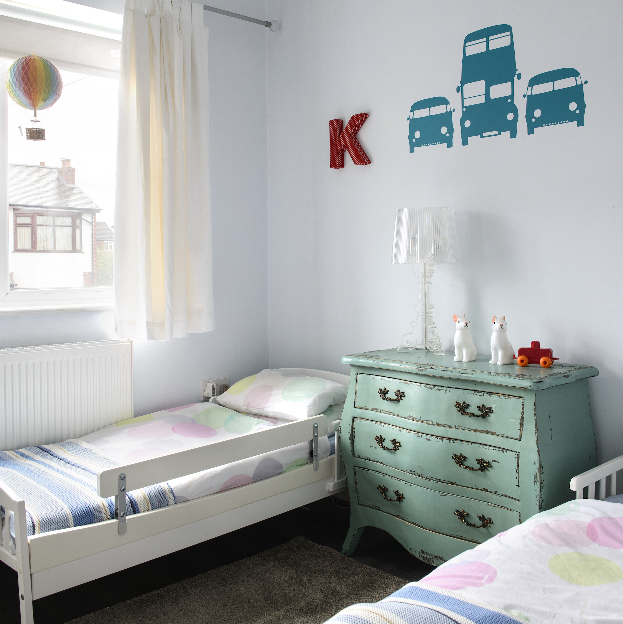 shared kids bedroom with vintage chest of drawers