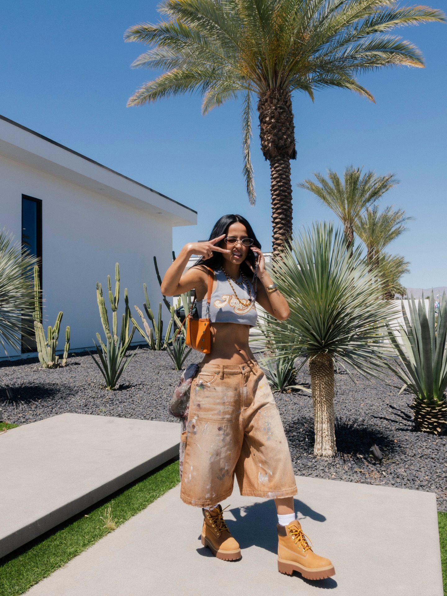 Becky G is wearing Guess shorts.