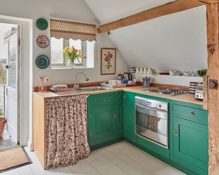Green kitchen cabinets painted in Leyland SDM trade paint in Sarah Vanrenen Wiltshire country barn