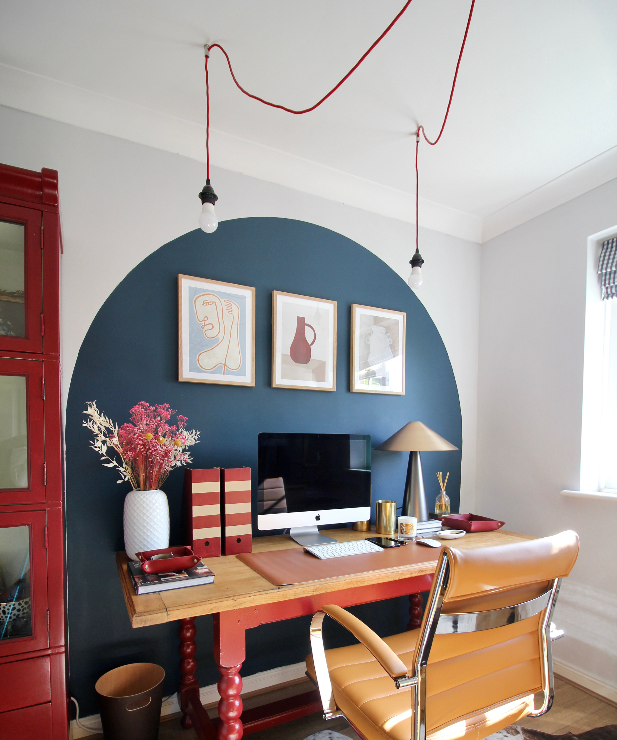 desk with exposed bulb pendant lighting above
