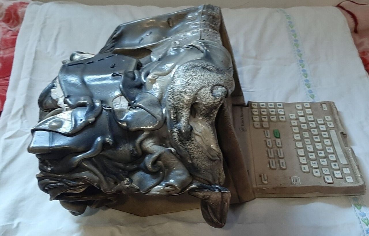 Side view of melted Alcatel Minitel 2