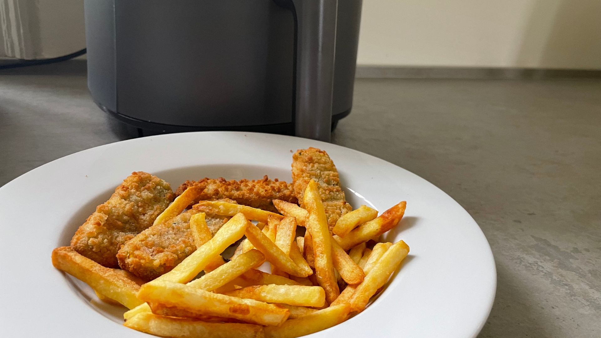 Fish fingers and chips in front of the Cosori Lite Air Fryer