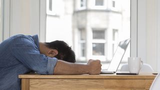 Man upset using a Windows 10 laptop