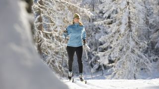 A woman cross country skiing