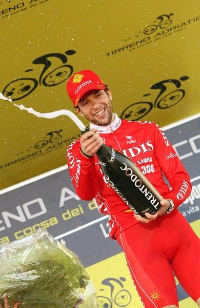 Julien El Far&egrave;s (Cofidis) celebrates on the podium with a bit of bubbly.