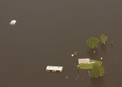 A house sits in floodwater outside of Meyer, Illinois.