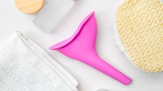 Pink silicone funnel between hygiene products