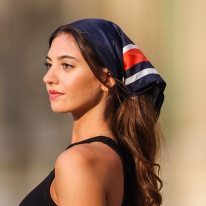 women in the french rivieria wearing red lipstick and a head scarf