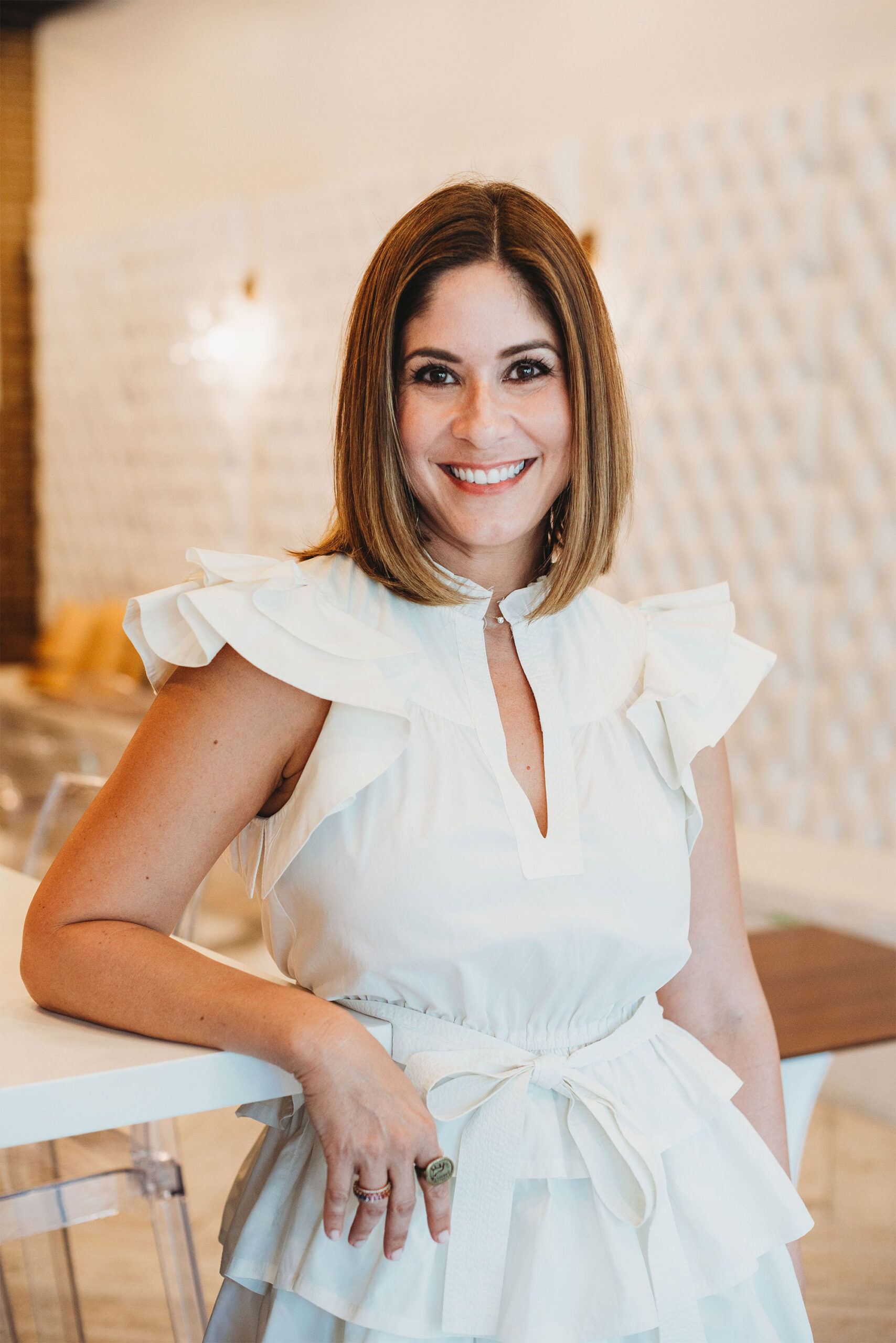 a woman in a white shirt posing for a picture