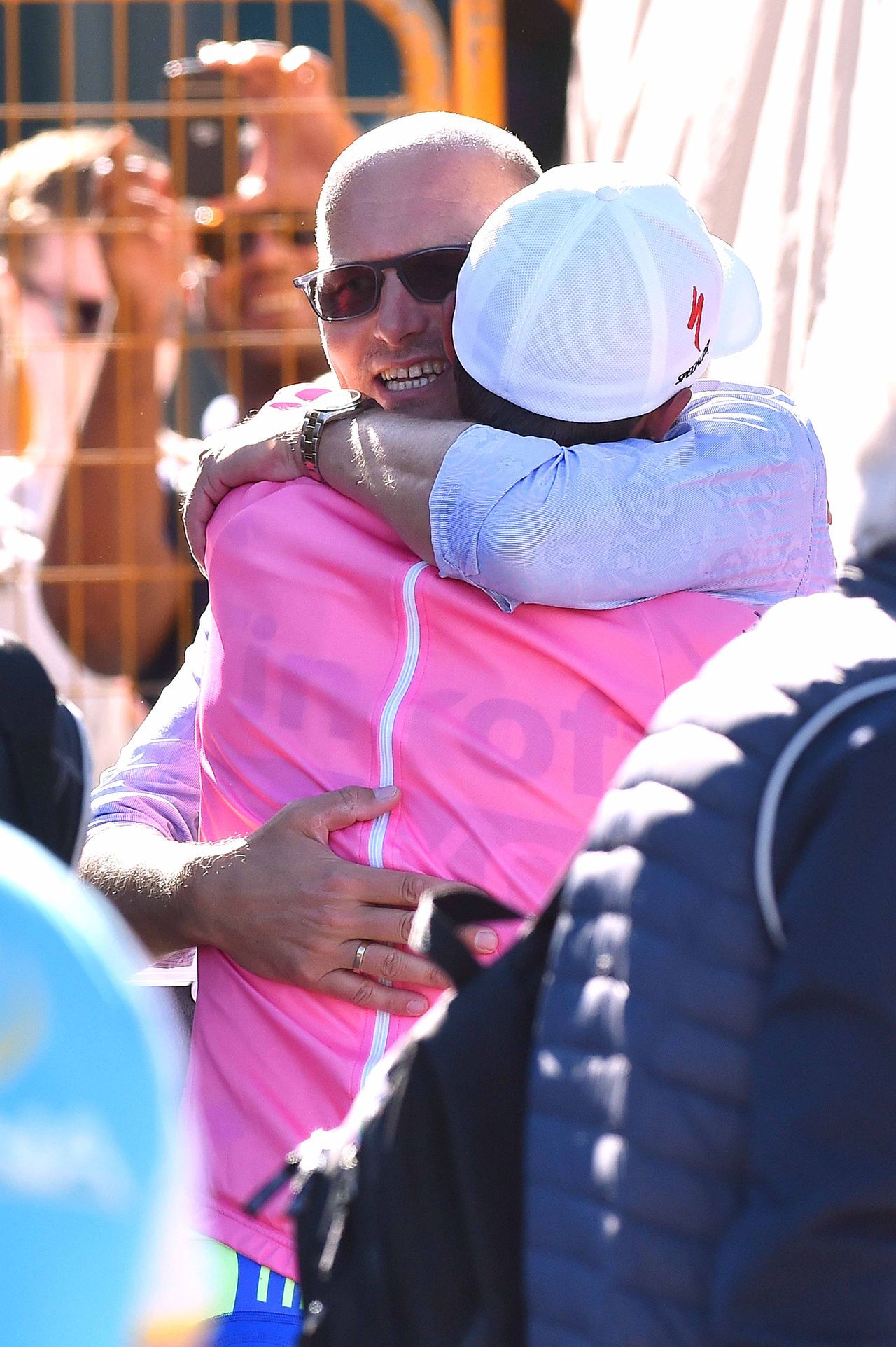 Bjarne Riis gives Alberto Contador a big hug after the podium presentations