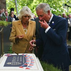 King Charles and Queen Camilla eating