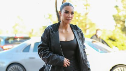  Kim Kardashian wearing a black leather trench coat