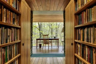 Two bookshelves in the passageway, with the space overlooking a balcony