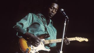 Buddy Guy performs onstage in London in October 1965