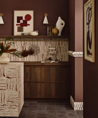 A dark kitchen decorated with patterned tiles