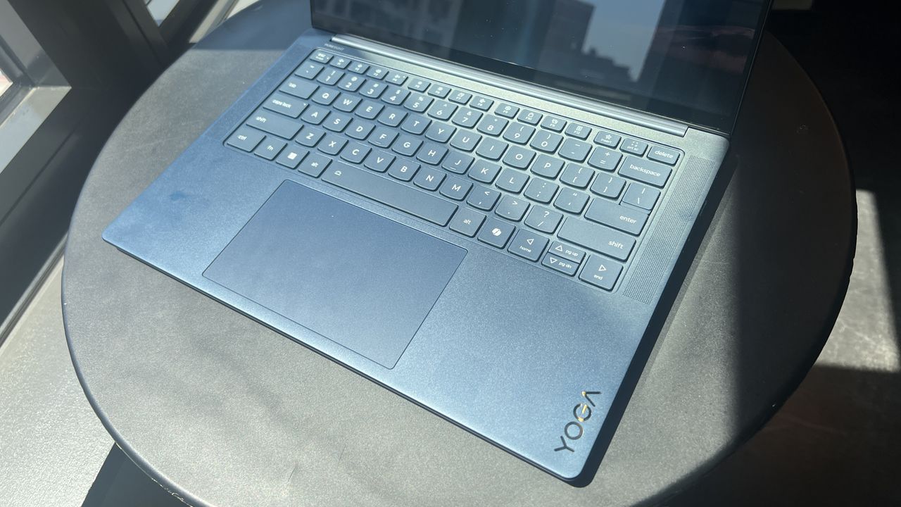 blue laptop on table
