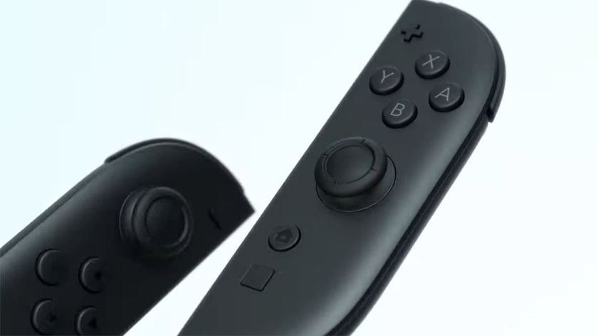 The new Nintendo Switch 2 Joy-Cons on a white background. They&#039;re black with some pops of colour around the sticks, and there&#039;s a new button under the home button