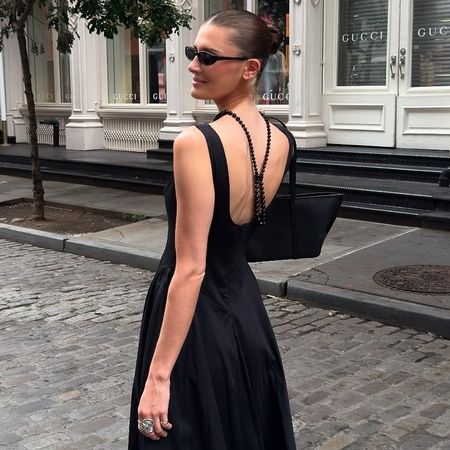 NYC style influencer Coco Schiffer wearing a chic black dress outfit for 2026