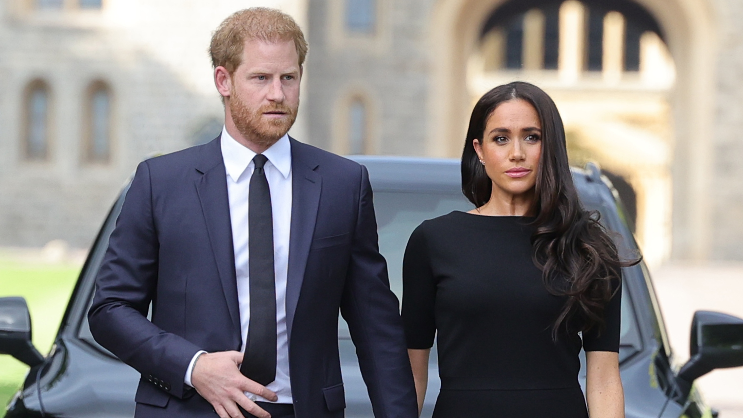 Prince Harry and Meghan, Duchess of Sussex arrive on the long Walk at Windsor Castle arrive to view flowers and tributes to HM Queen Elizabeth on September 10, 2022