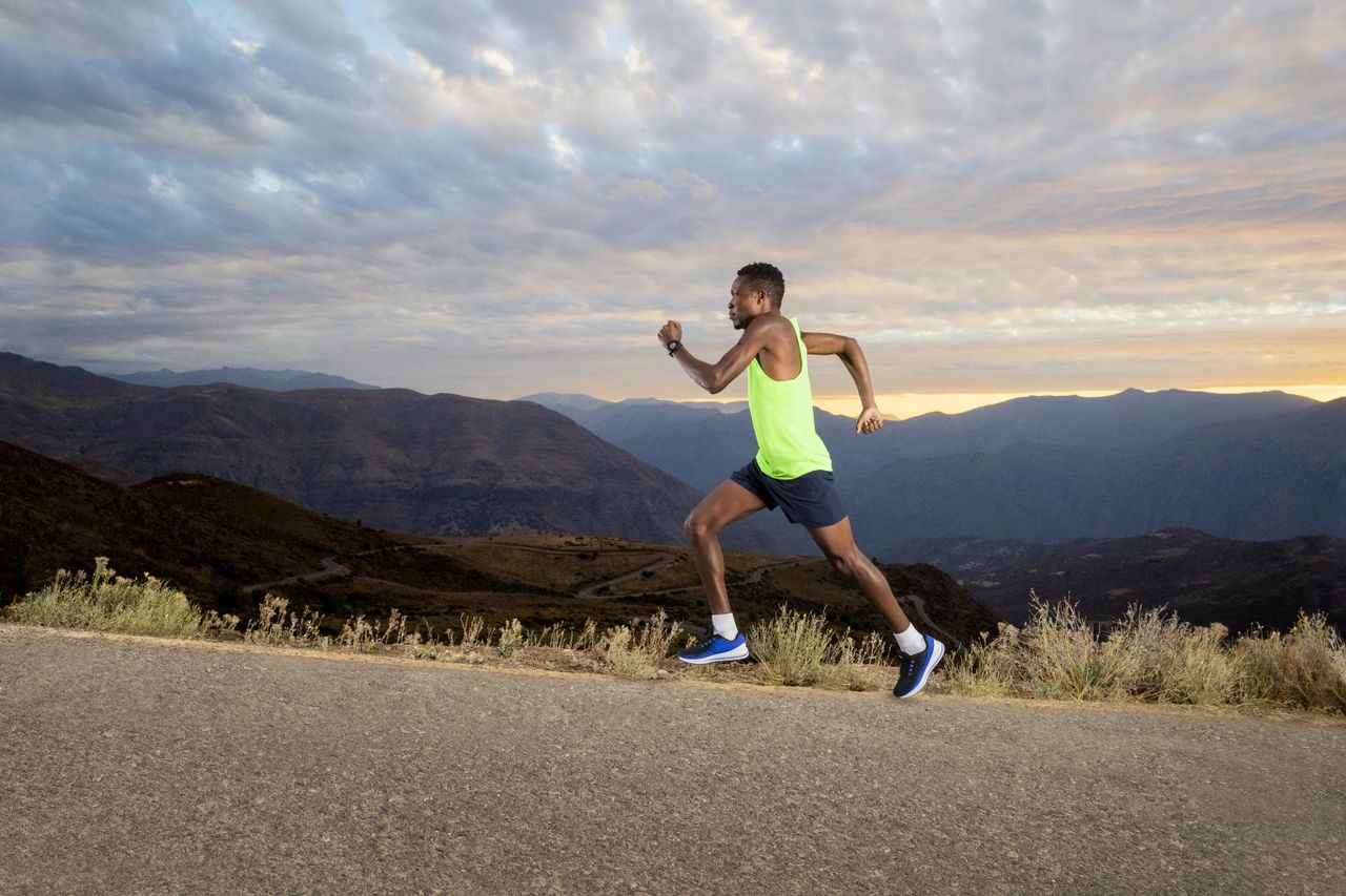Garmin Forerunner 945 worn by an African athlete running uphill