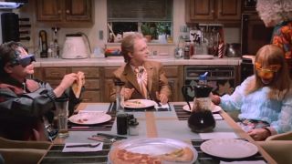 The McFly family sits around the dinner table in Back To The Future: Part II.