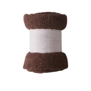 A rolled-up chocolate brown teddy throw blanket, secured by a piece of canvas cloth