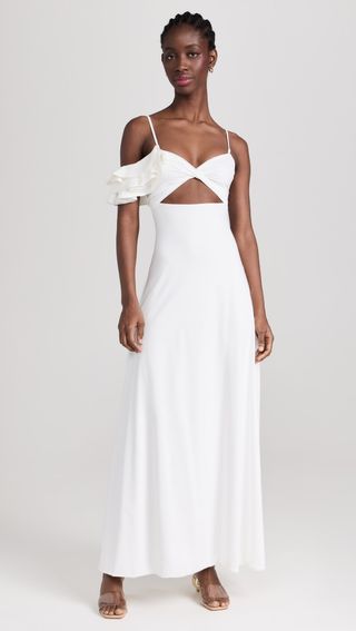 model wears white dress with midriff cutout