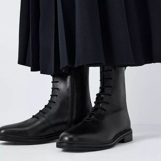 flat lay image of black boots