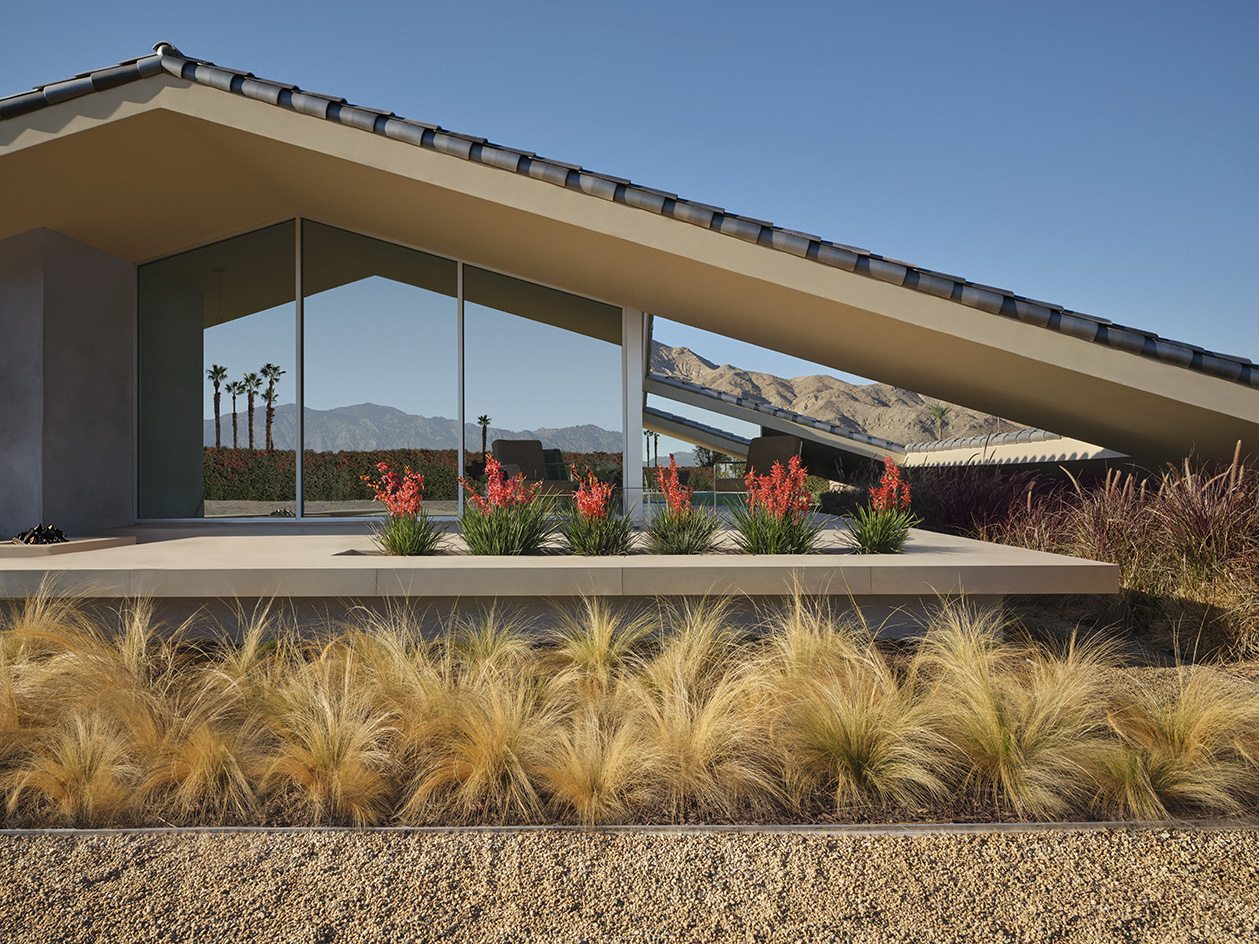 Desert house by Robert Stone, a home made with perforated partitions and an intense pitched low roof