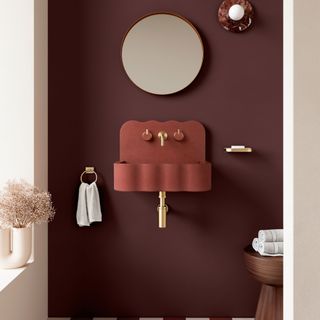 Brown bathroom with mirror and red sink