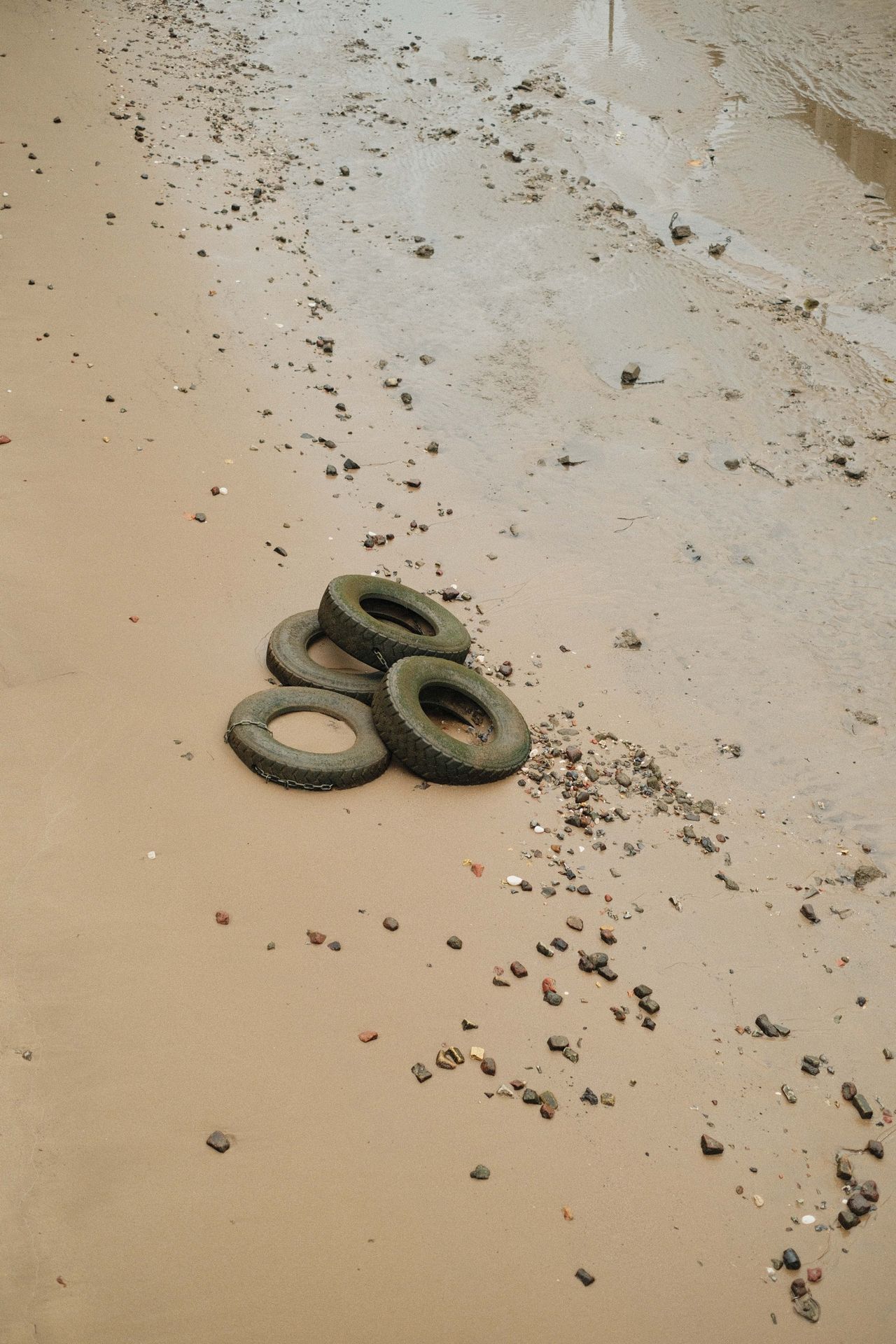 Old tires washed up on a beach